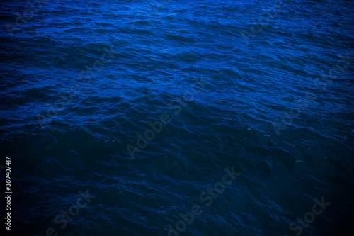 dark deep blue sea water surface background. Backdrop design for art work or add text message.