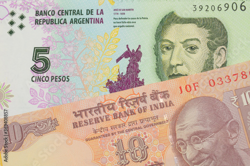 Wallpaper Mural A macro image of a orange ten rupee bill from India paired up with a colorful five peso note from Argentina.  Shot close up in macro. Torontodigital.ca