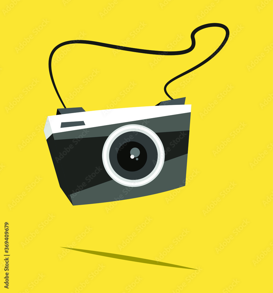  Black camera on yellow background with shadow. 