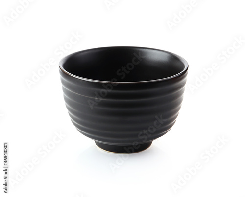 Black cup of soup isolated on a white background