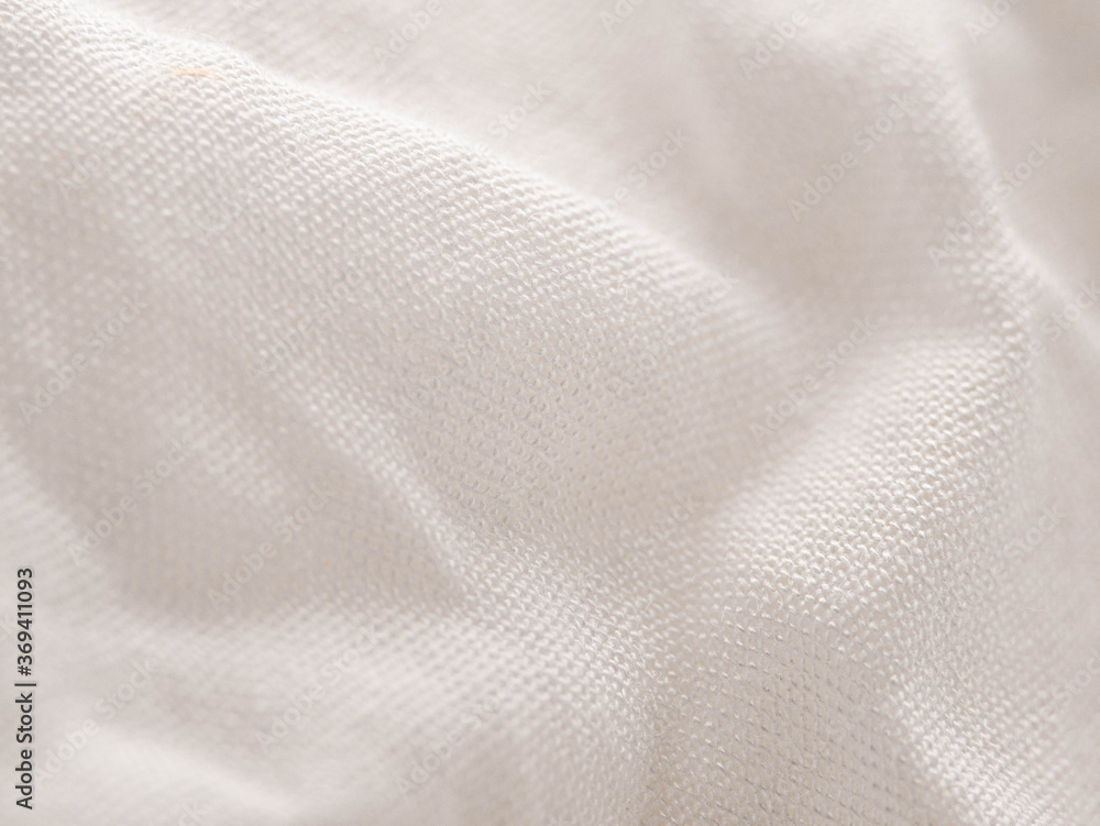Texture of white fabric shows a soft, comfortable feel. Abstract background. Texture of white fabric shows a soft, comfortable feel. Abstract background.
