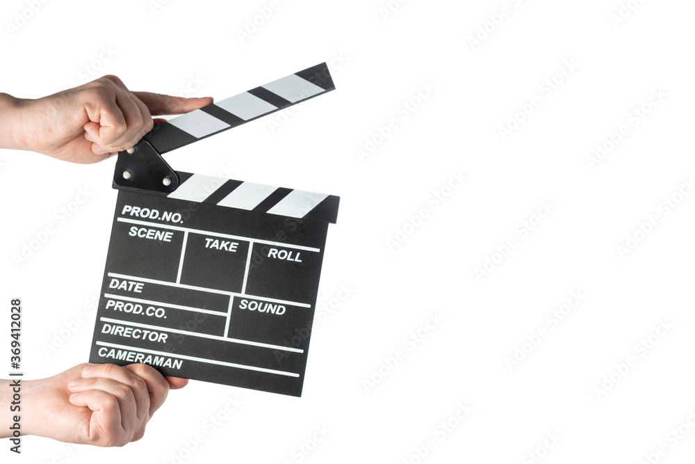 Movie clapperboard in hands on white isolated background