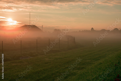 Dawn fog above a hill