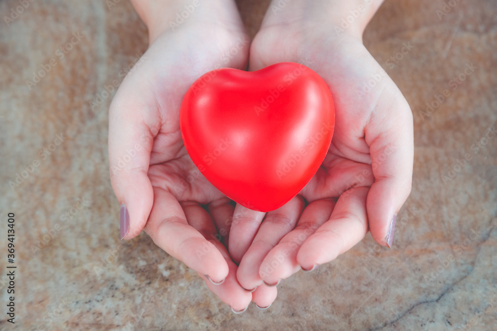 Fototapeta premium Woman hold red heart