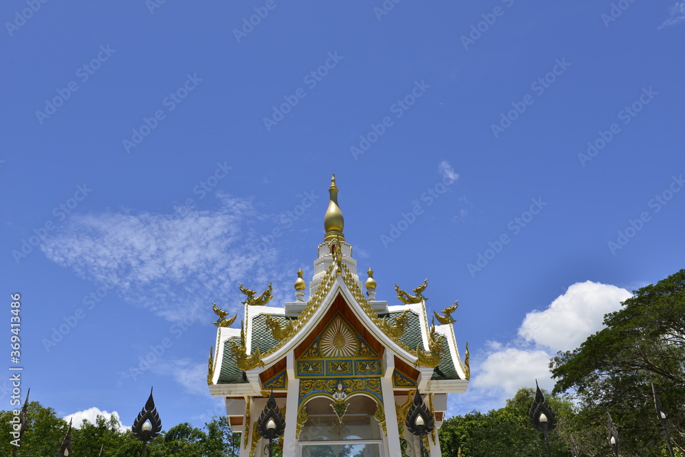 Fototapeta premium Beautiful Thai sculpture with blue sky background at Wat Aran Banphot Sri Chiang Mai District. Nong Khai Province, Thailand. 