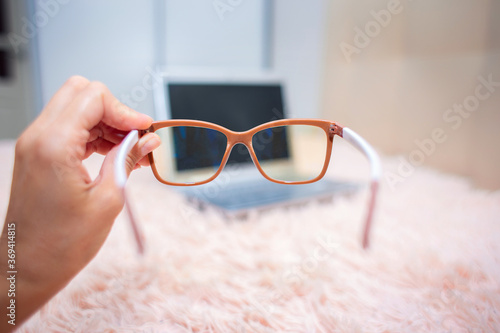 View of a laptop through special glasses for working on a computer.