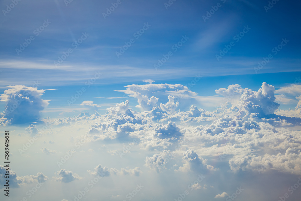 Sky and clouds from above the ground viewed from an airplane Sky and clouds from above the ground viewed from an airplane