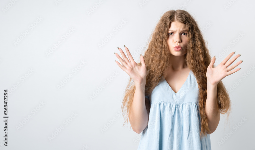 Positive human emotions, reaction and astonishment. Surprised girl with curly long hair opening eyes widely and gesturing emotionally, excited because receives surprise from boyfriend, feels glad Positive human emotions, reaction and astonishment. Surprised girl with curly long hair opening eyes widely and gesturing emotionally, excited because receives surprise from boyfriend, feels glad