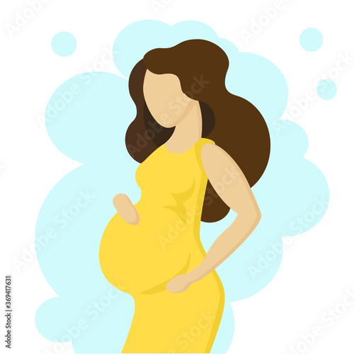 Pretty pregnant woman stands sideways hugging belly. Expectant mother in a beautiful yellow dress is waiting for the baby to appear.