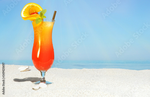 Sex on the Beach Cocktail on Beach Background