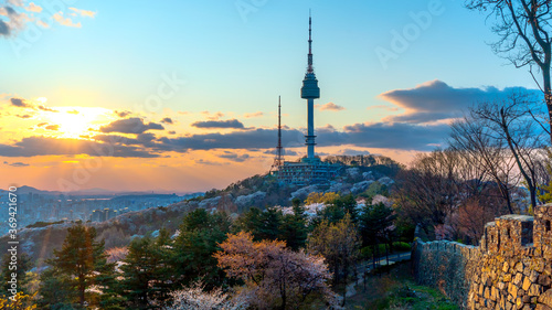 View of sunset in seoul city with seoul tower at namsan public park photo