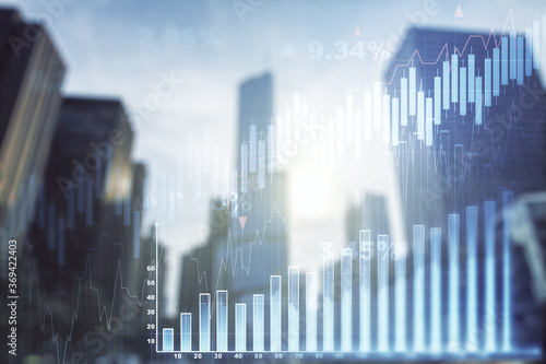 Double exposure of abstract financial graph on office buildings background, financial and trading concept