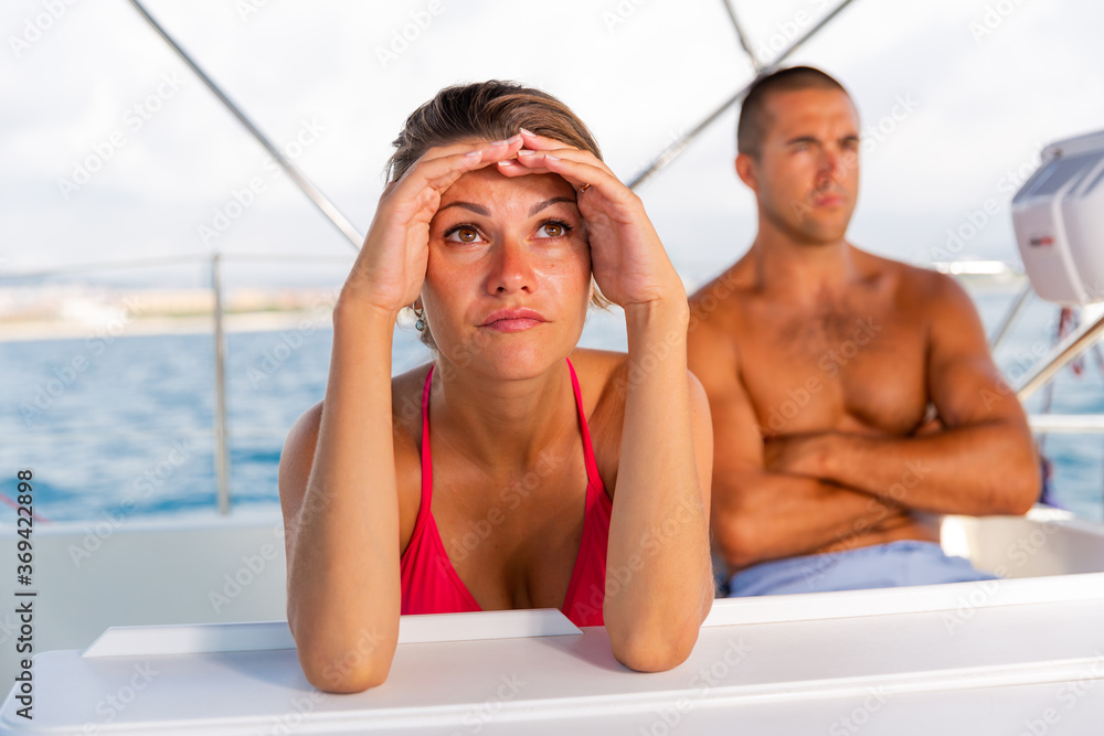 Upset girl dont speaking with boyfriend after discord during sea travel on yacht