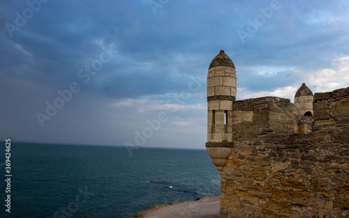 Against the background of a stormy sky, the towers of the Yenikale fortress . Castle, fortress, landscape.Space for text.
