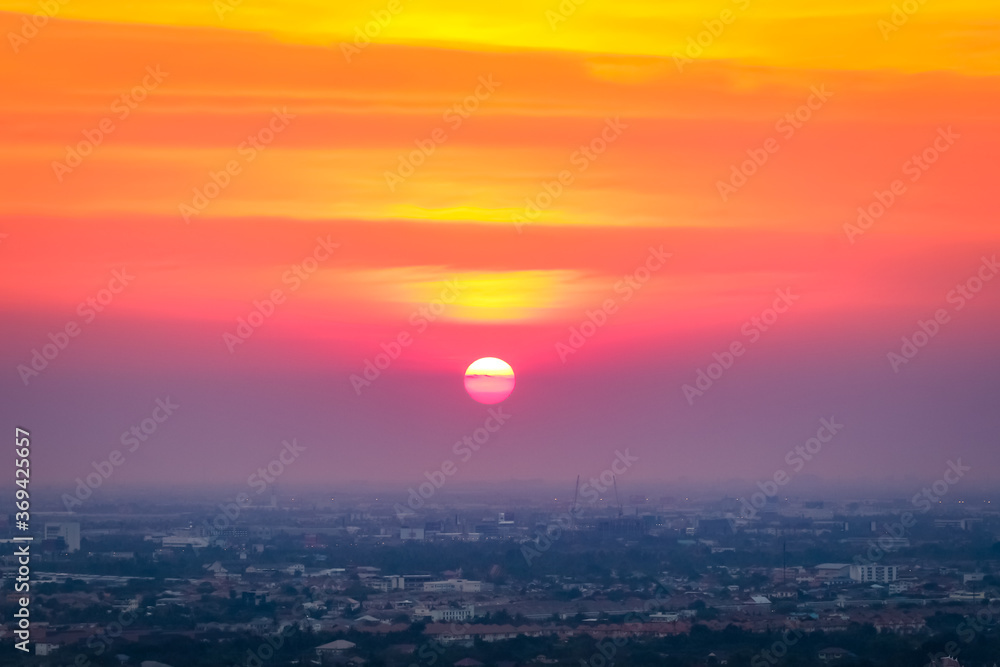 Sunrise sunset in the city with selective focus on the sun Sunrise sunset in the city with selective focus on the sun