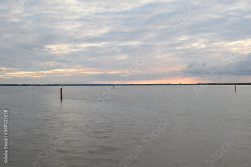 Long exposure golden sunset over Breydon Water, a stretch of the River Yare at Great Yarmouth, Norfolk, UK © Christopher Keeley