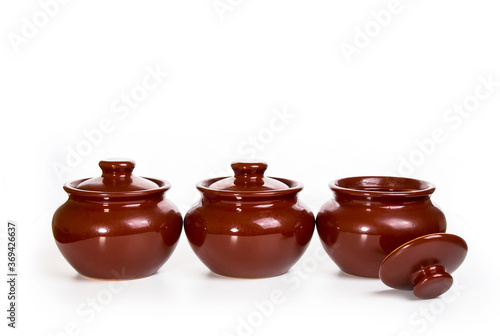 three ceramic pots for oven isolated on white background
