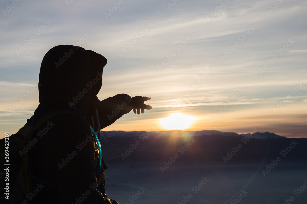 silhouette of a person pointing finger