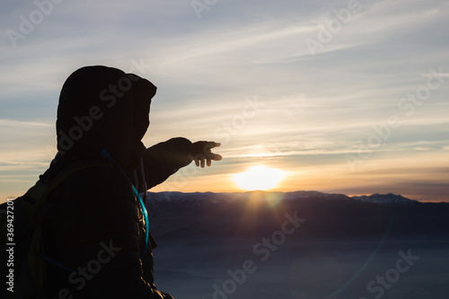 silhouette of a person pointing finger