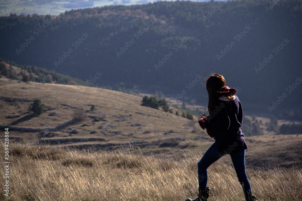 Beautiful model walking in the hills of Italy