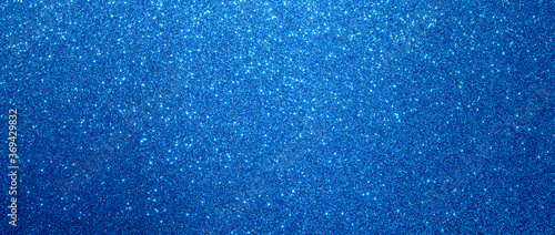 blue glitter christmas background. Close-up shot of glittery texture or new year or valentine day designs.