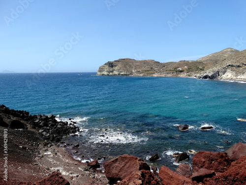 Natural landscape of Red Beach in Akrotiri on Santorini Island, Greece. Red Beach is famed for its titular red-hued sand, and is a noted for being popular tourist attraction.