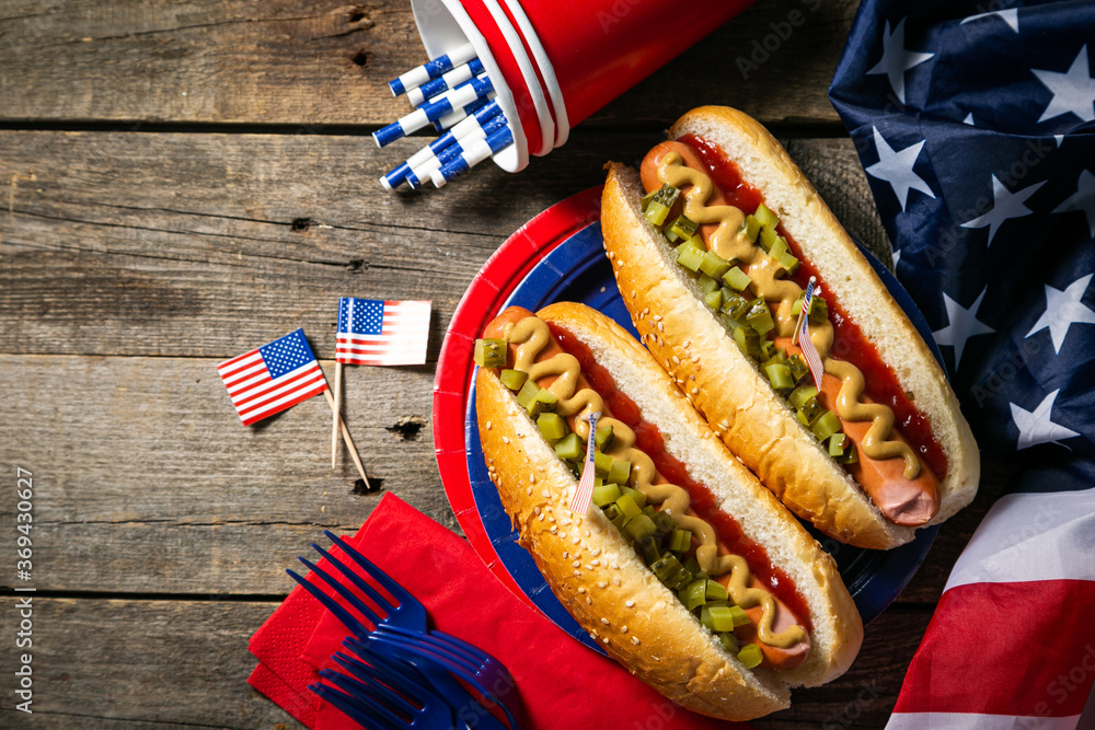 USA national holiday Labor Day, Memorial Day, Flag Day, 4th of July - hot dogs with ketchup and mustard on wood background, copy space - obrazy, fototapety, plakaty 