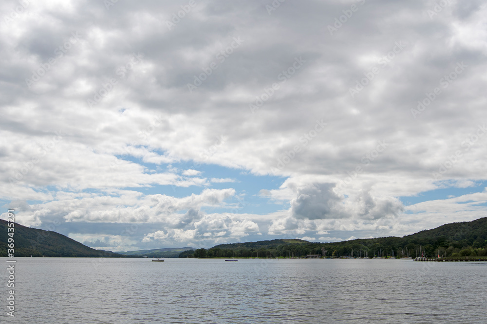 Clouds over Coniston Waters, in Coniston, in the Lake District, Cumbria, England. Clouds over Coniston Waters, in Coniston, in the Lake District, Cumbria, England.