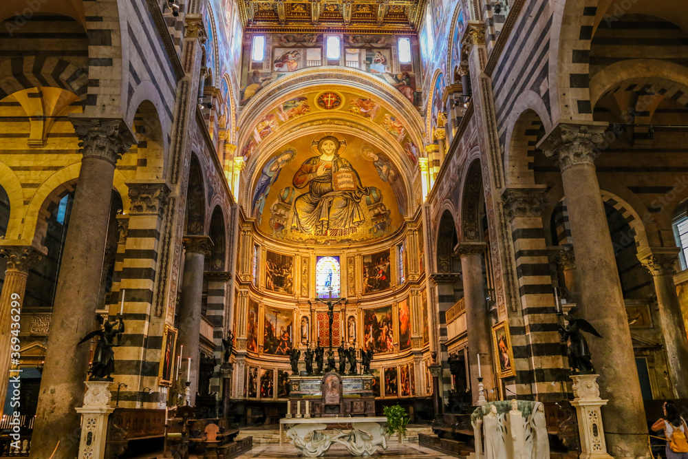 In front of the altar inside the beautiful Pisa Cathedral (Duomo di Pisa) with the impressive mosaic of Christ in Majesty, in the apse, flanked by the Blessed Virgin and St. John the Evangelist. In front of the altar inside the beautiful Pisa Cathedral (Duomo di Pisa) with the impressive mosaic of Christ in Majesty, in the apse, flanked by the Blessed Virgin and St. John the Evangelist.