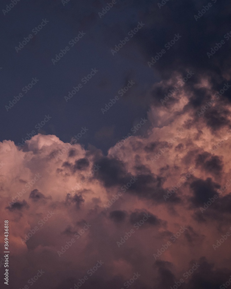 clouds in the sky, big clouds like mountains, golden clouds, sunset clouds in the sky, big clouds like mountains, golden clouds, sunset