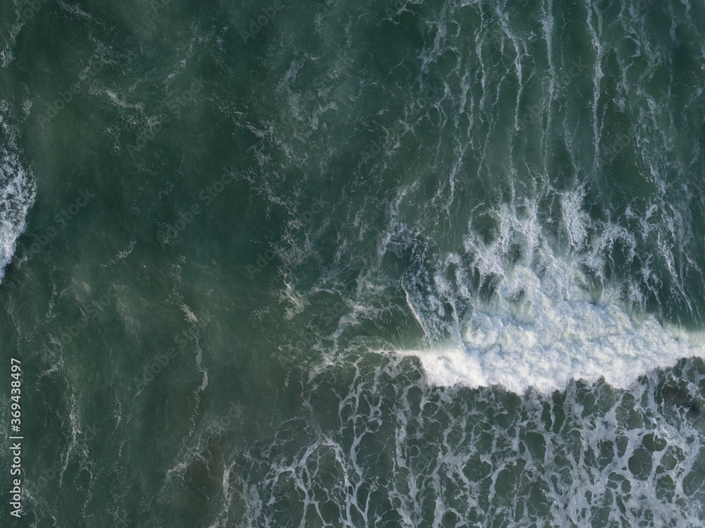 Aerial photo of a small surf break off the coast of New Zealand. Aerial photo of a small surf break off the coast of New Zealand.
