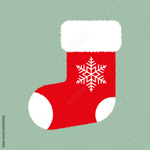 Red fluffy Christmas stocking with white snowflake on green background. Vector Christmas gift sock. Flat vector Illustration. Simple design for web and print. Xmas icon