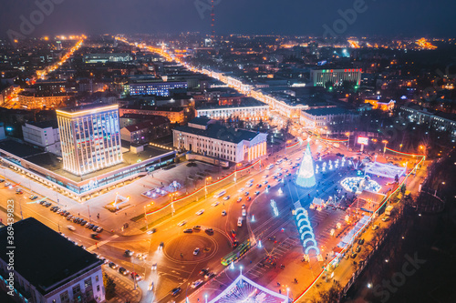 Gomel, Belarus. Main Christmas Tree And Festive Illumination On Lenin Square In Homel. New Year In Belarus. Aerial Night View