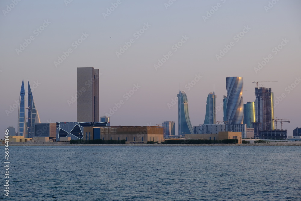 Bahrain city skyline captured during summer golden hour.