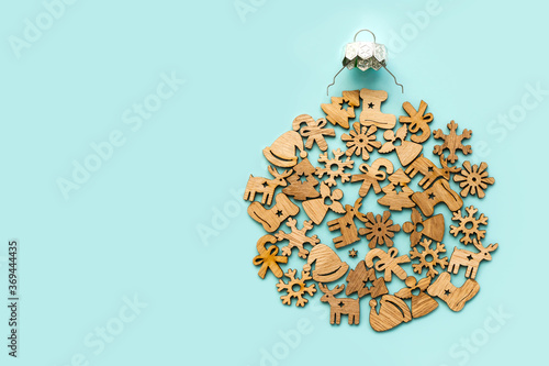 Christmas objects laid out in the shape of a Christmas bauble, overhead view