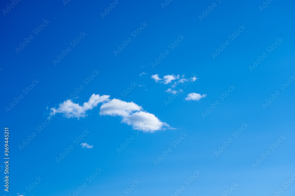 Cloud against a blue sky. Background. Copy space for text. Cloud against a blue sky. Background. Copy space for text.