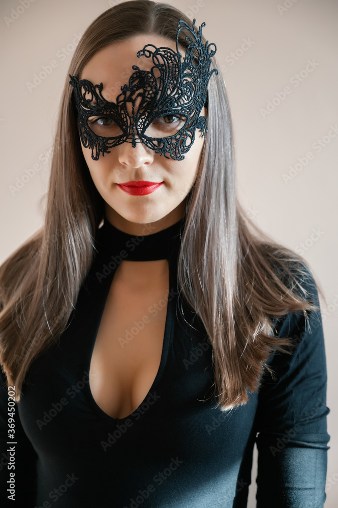 Close-up of woman face in carnival mask. Selective focus.