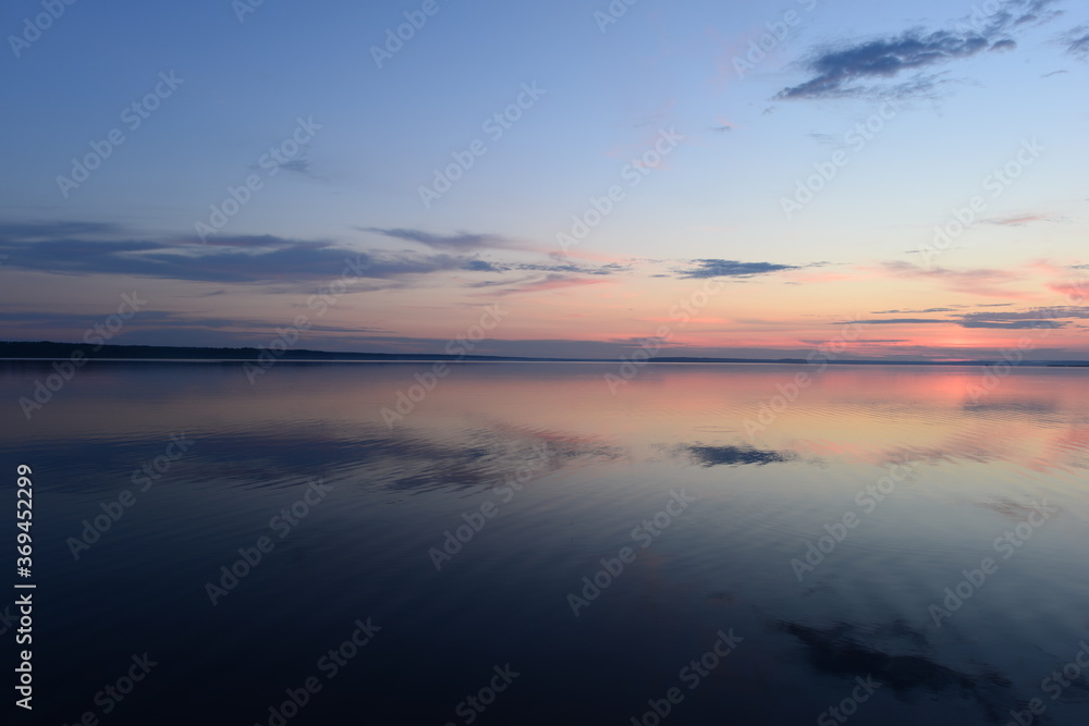 Twilight blue sky in the silence of a summer evening over calmness water lake