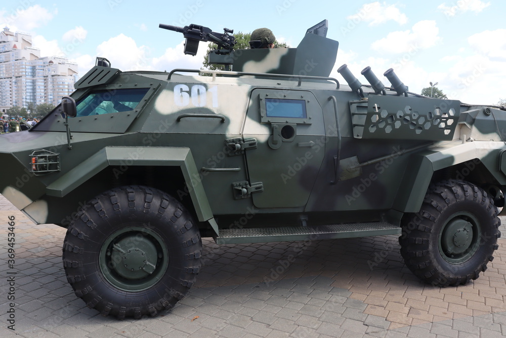 Fototapeta premium military trucks with army at Minsk street