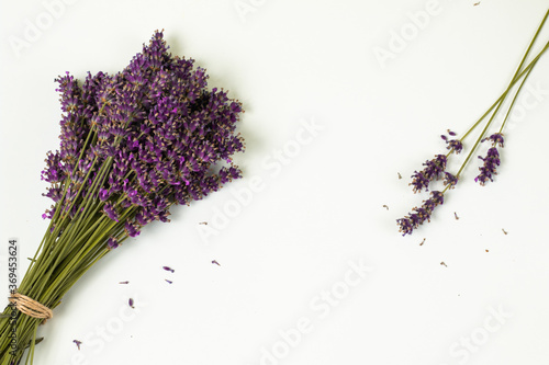 Stack of violet lavender on a white pale background