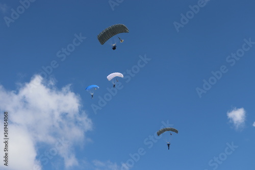 paratrooper parachutist soliders landing at parade ceremony