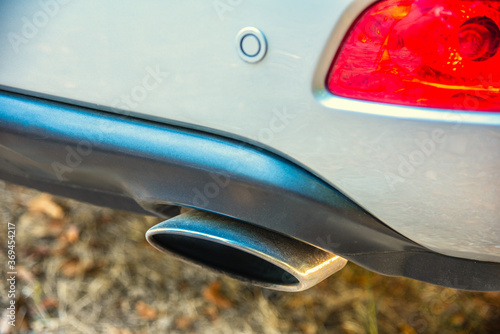 Right exhaust chromed pipe of a mondern SUV photo