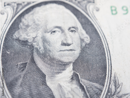 portrait of the first president of the United States, the US founding father George Washington on the one dollar bill, background of the money, one dollar bills front side obverse. close up, America 