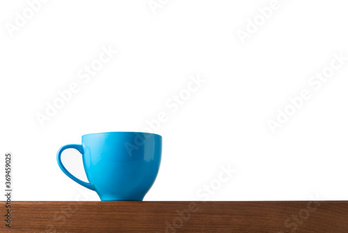 Blue cup on table with isolated background