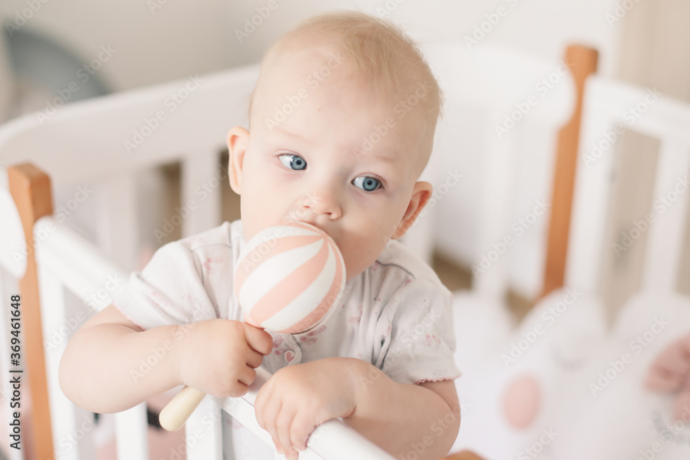 Cute little baby girl playing with toys at home or nursery. Happy healthy child having fun with colorful toy. Cute little baby girl playing with toys at home or nursery. Happy healthy child having fun with colorful toy.