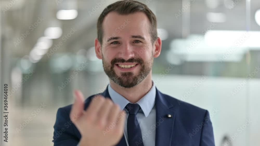 Portrait of Businessman Pointing Finger and Inviting Portrait of Businessman Pointing Finger and Inviting