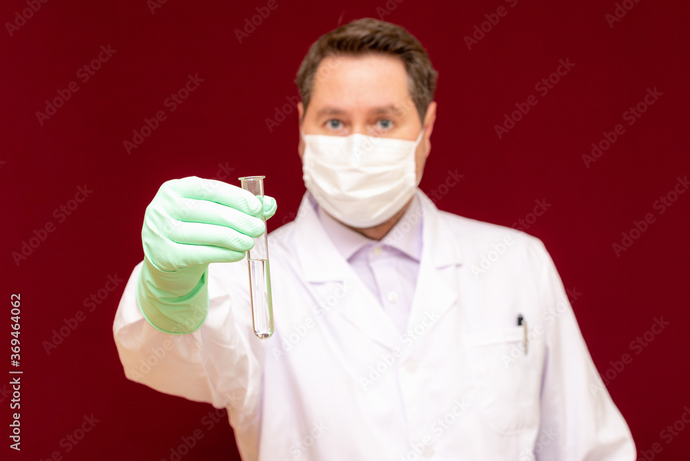 Scientist or medical in lab coat holding test tube with reagent, Biochemistry laboratory research.Burgundy background. Scientist or medical in lab coat holding test tube with reagent, Biochemistry laboratory research.Burgundy background.