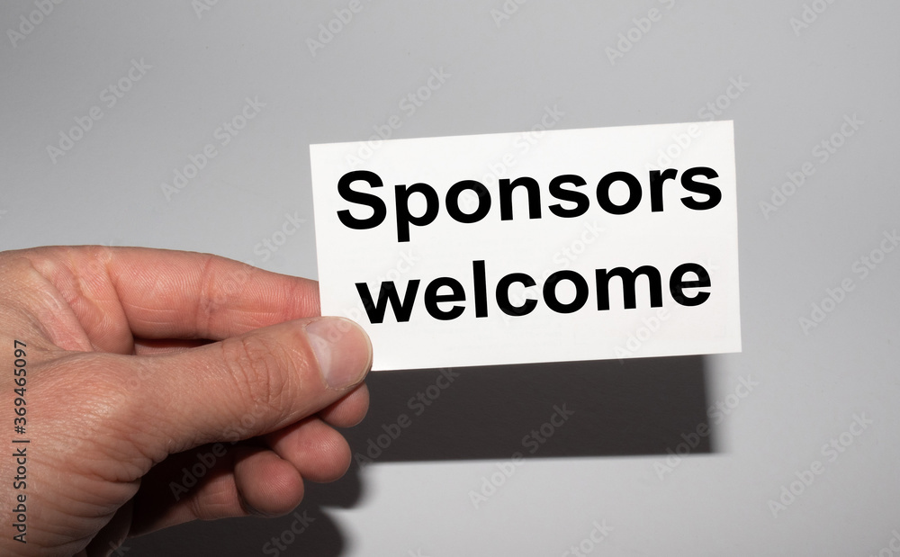 Message on the card SPONSORS WELCOME, in hands of businessman. Message on the card SPONSORS WELCOME, in hands of businessman.