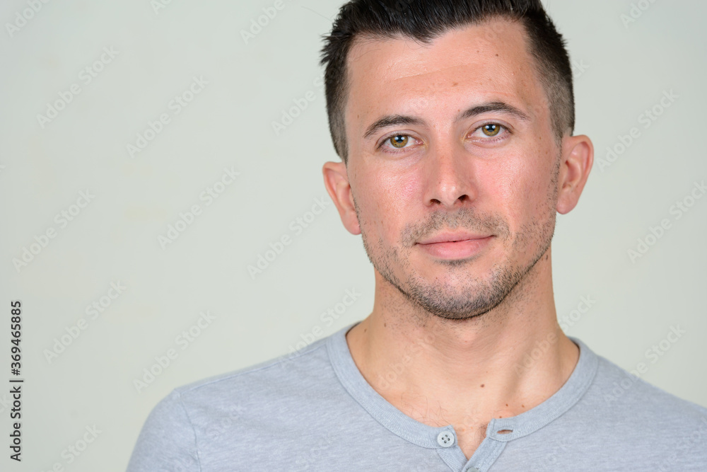 Fototapeta premium Portrait of young handsome man with beard stubble