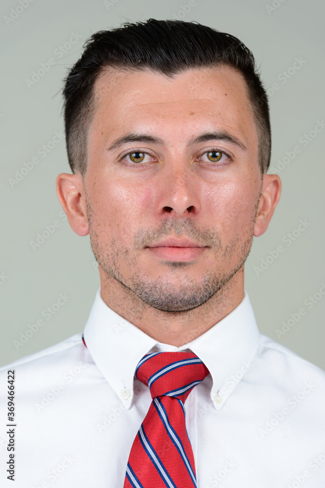 Portrait of young handsome businessman looking at camera Portrait of young handsome businessman looking at camera
